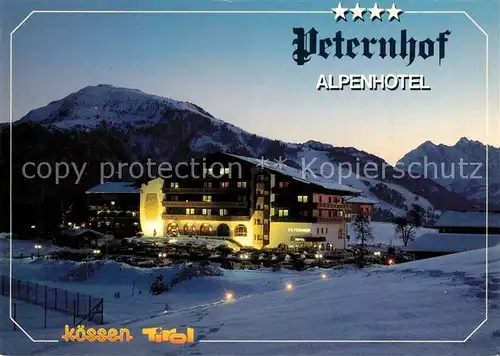 AK / Ansichtskarte Koessen_Tirol Alpenhotel Peternhof im Winter Abendstimmung Koessen Tirol