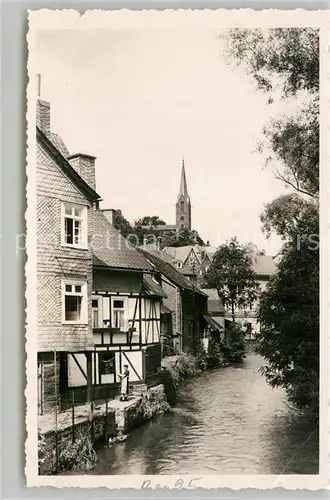 AK / Ansichtskarte Bad_Berleburg Haeuserpartie an der Odeborn Blick zur Kirche Bad_Berleburg