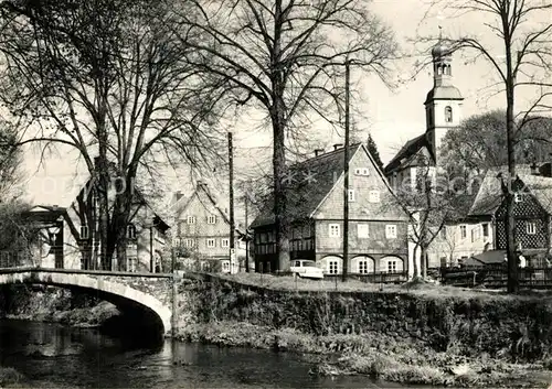 AK / Ansichtskarte Grossschoenau_Sachsen Partie am Fluss Blick zur Kirche Grossschoenau Sachsen