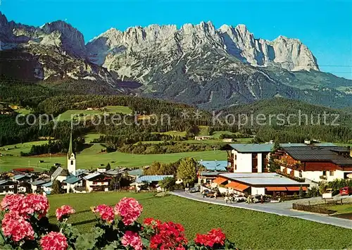 AK / Ansichtskarte Ellmau_Tirol Sportcenter mit Wildem Kaiser Kaisergebirge im Sommer Blumen Ellmau Tirol