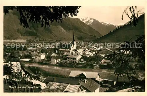 AK / Ansichtskarte Bruck_Grossglocknerstrasse Ortsansicht mit Kirche Alpenpanorama Hohe Tauern Bruck