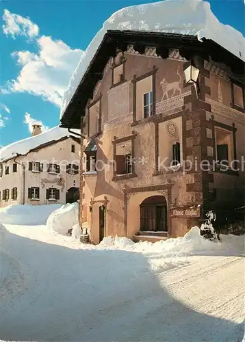 AK / Ansichtskarte Engadin_GR Engadiner Haus Dorfpartie im Winter Engadin_GR