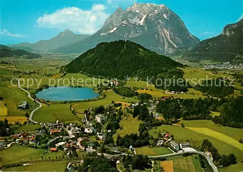 AK / Ansichtskarte Aigen_Ennstal_Steiermark Sommerfrische Putterersee Blick gegen Grimming Dachsteingebirge Fliegeraufnahme Aigen_Ennstal_Steiermark