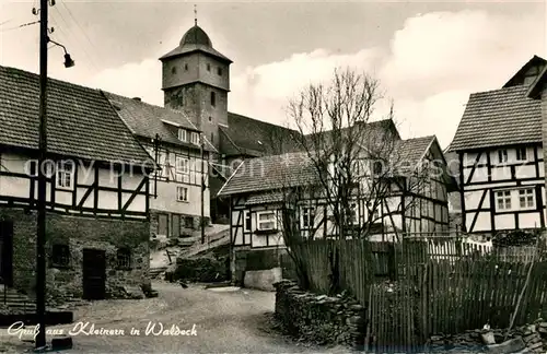 AK / Ansichtskarte Kleinern Dorfmotiv mit Kirche Fachwerkhaeuser Kleinern