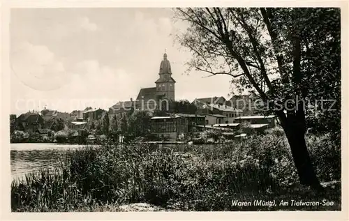 AK / Ansichtskarte Waren_Mueritz Partie am Tiefwarensee Blick zur Kirche Waren Mueritz