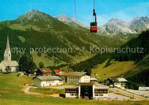 Mittelberg_Kleinwalsertal Ortsmotiv mit Kirche Walmendingerhorn Bergbahn Alpen Mittelberg_Kleinwalsertal