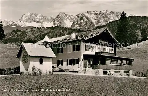 AK / Ansichtskarte Garmisch Partenkirchen Gschwandtnerbauer gegen Karwendel Garmisch Partenkirchen