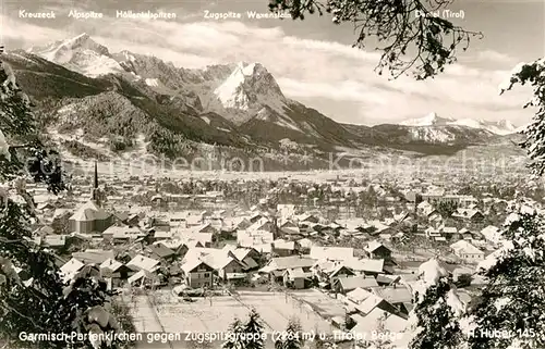 AK / Ansichtskarte Garmisch Partenkirchen Gesamtansicht gegen Zugspitzgruppe und Tiroler Berge Huber Karte Nr 145 Garmisch Partenkirchen
