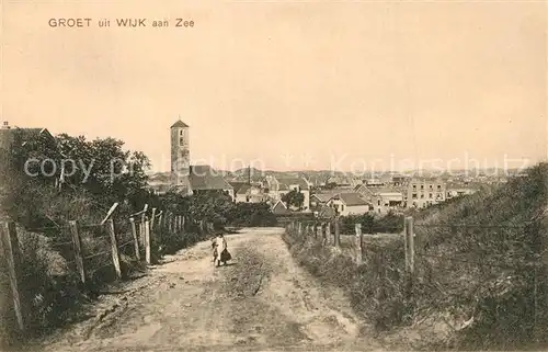 AK / Ansichtskarte Wijk_aan_Zee Weg zum Ort Blick zur Kirche Wijk_aan_Zee