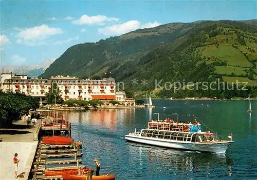AK / Ansichtskarte Zell_See Uferpromenade mit Grand Hotel Fahrgastschiff Zell_See