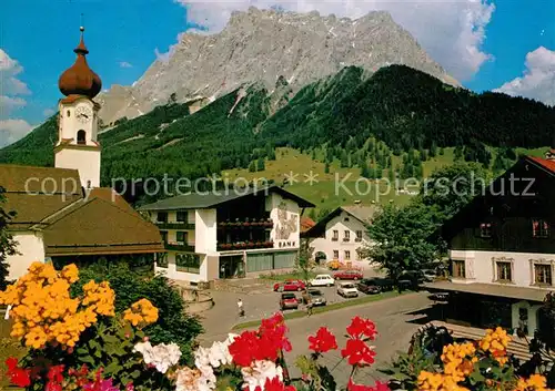 AK / Ansichtskarte Ehrwald_Tirol Hotel Sonnenspitze Blumen Blick zur Kirche Zugspitze Wettersteingebirge Ehrwald Tirol