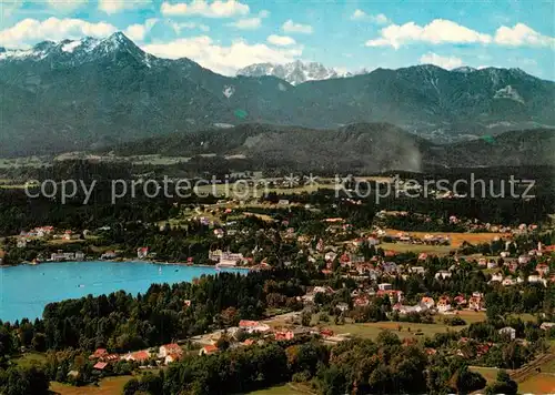 AK / Ansichtskarte Velden_Woerthersee Panorama mit Blick zum Mittagskogel Karawanken Fliegeraufnahme Velden Woerthersee