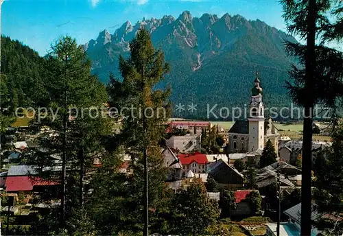 AK / Ansichtskarte Dobbiaco_Pustertal_Suedtirol Ortsmotiv mit Kirche Dolomiten Dobbiaco_Pustertal
