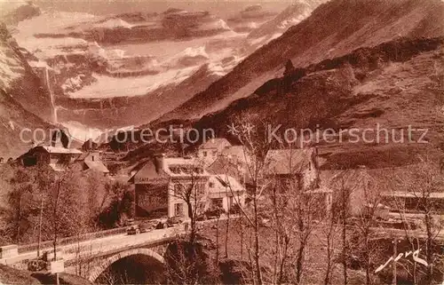 AK / Ansichtskarte Gavarnie_Hautes Pyrenees Entree du village au fond le Cirque Heliogravure de Luxe Gavarnie Hautes Pyrenees