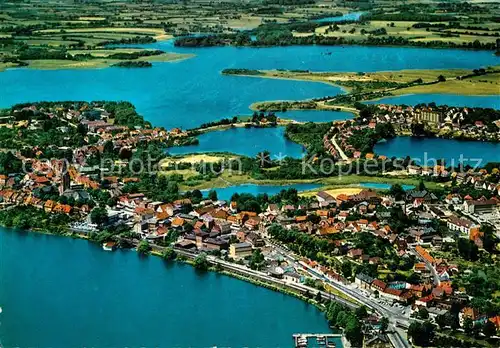 AK / Ansichtskarte Ploen_See Seenlandschaft Holsteinische Schweiz Fliegeraufname Ploen_See