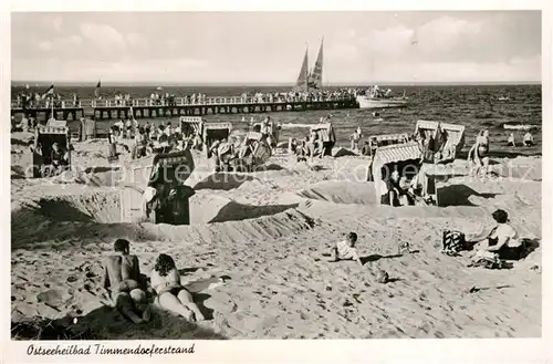 AK / Ansichtskarte Timmendorfer_Strand Strand mit Seebruecke Timmendorfer_Strand