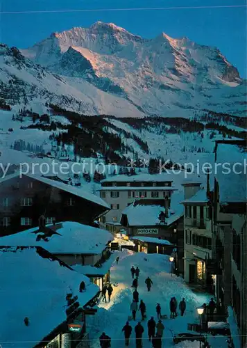 AK / Ansichtskarte Wengen_BE Wintersportort am Abend mit Jungfrau Berner Alpen Wengen_BE