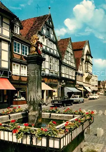 AK / Ansichtskarte Celle_Niedersachsen Loewenbrunnen am Grossen Plan Brunnen Fachwerkhaeuser Celle_Niedersachsen