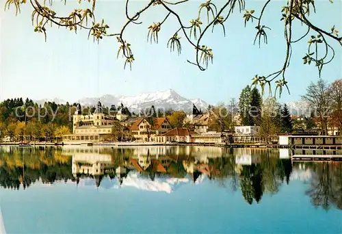 AK / Ansichtskarte Velden_Woerthersee Uferpartie am See Wasserspiegelung Blick gegen Mittagskogel Karawanken Velden Woerthersee