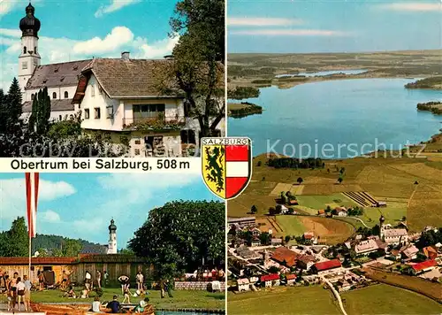 AK / Ansichtskarte Obertrum_See Pfarrkirche Obertrumer See mit Strandbad Fliegeraufnahme  Obertrum See