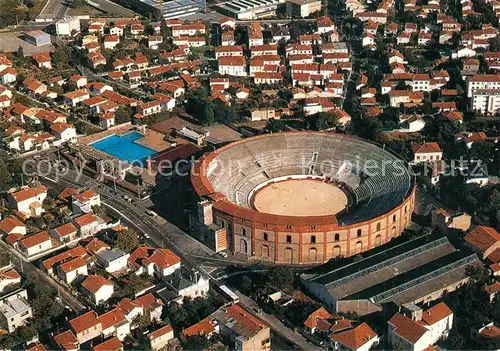 AK / Ansichtskarte Beziers Les Arenes vue panoramique aerienne Beziers