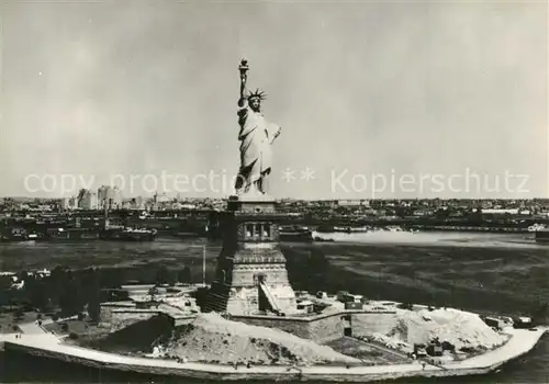 AK / Ansichtskarte New_York_City Statue of Liberty in front of New York Harbour aerial view New_York_City
