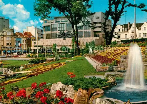 AK / Ansichtskarte Oostende_Ostende Blumenuhr und Postamt 