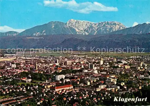 AK / Ansichtskarte Klagenfurt_Woerthersee Stadtpanorama mit Blick zum Hochobir Fliegeraufnahme Klagenfurt_Woerthersee