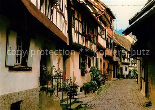 AK / Ansichtskarte Eguisheim_Haut_Rhin Ruelle aux maisons pittoresques Eguisheim_Haut_Rhin