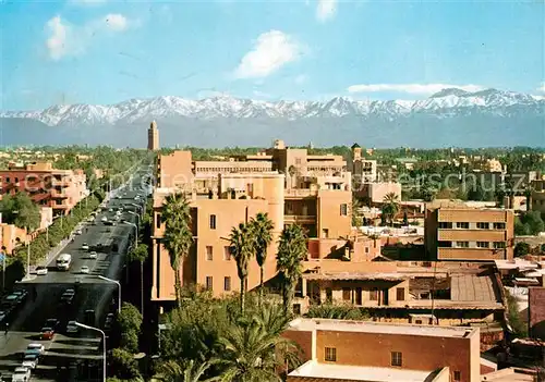 AK / Ansichtskarte Marrakech_Marrakesch Avenue Mohamed der 5. und Atlasgebirge Marrakech Marrakesch