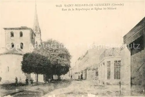 AK / Ansichtskarte Saint Medard de Guizieres Rue de la Republique et Eglise St Medard Saint Medard de Guizieres