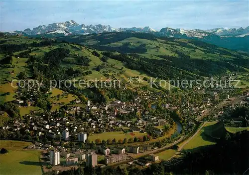 AK / Ansichtskarte Wattwil mit Saentis und Churfirsten Alpen Fliegeraufnahme Wattwil