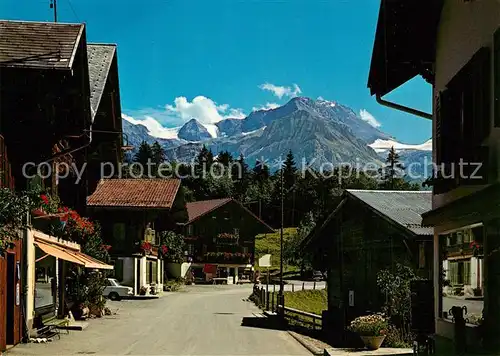 AK / Ansichtskarte Lauenen Ortsmotiv mit Blick zum Wildhorn Berner Alpen Lauenen