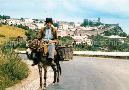 AK / Ansichtskarte Obidos A caminho do mercado Esel Lasttier auf dem Weg zum Markt Stadtmauer Obidos