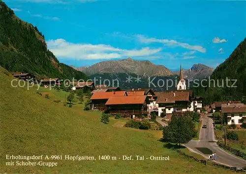 AK / Ansichtskarte Hopfgarten_Defereggen Ortsansicht mit Kirche Blick gegen Schobergruppe Hohe Tauern Hopfgarten Defereggen
