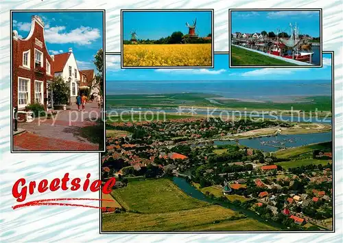 AK / Ansichtskarte Greetsiel Friesenhaeuser Windmuehle Hafen Fliegeraufnahme Greetsiel