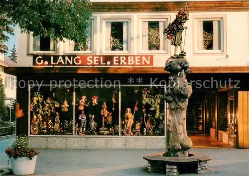 AK / Ansichtskarte Oberammergau Firma Lang Geschaeftsraeume Kraxentraeger Oberammergau