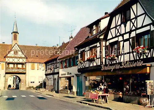 AK / Ansichtskarte Rosheim_Elsass_Lothringen La rue du General de Gaulle avec ses maisons alsaciennes a colombages la Porte de lEcole et dans le fond la Porte de la Vierge Rosheim_Elsass_Lothringen
