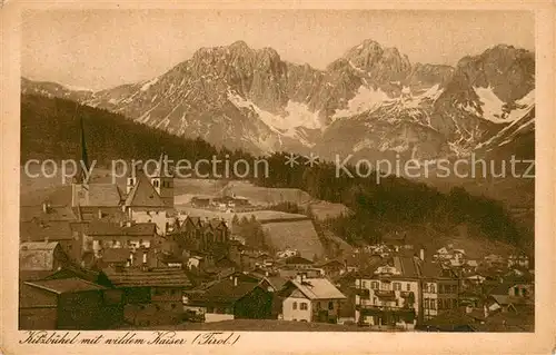 AK / Ansichtskarte Kitzbuehel_Tirol Ortsansicht mit Kirche Wilder Kaiser Kaisergebirge Alpen Kitzbuehel Tirol