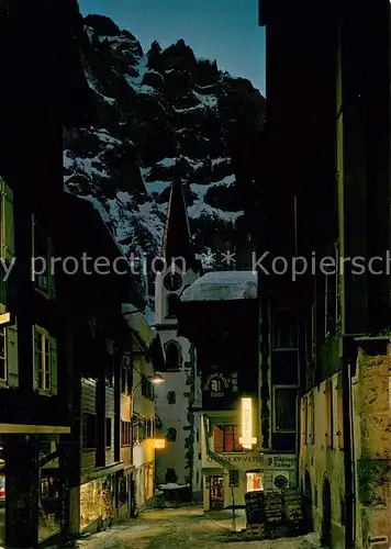AK / Ansichtskarte Leukerbad Dorfstrasse bei Nacht Leukerbad