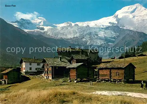 AK / Ansichtskarte Saas Fee Bergdorf mit Alphubel und Taeschhorn Walliser Alpen Saas Fee
