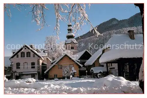 AK / Ansichtskarte Kranjska_Gora Kirchenpartie im Winter Kranjska Gora