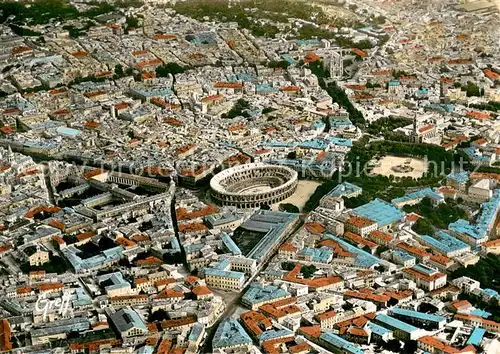 AK / Ansichtskarte Nimes Vue aerienne Les Arenes et l Esplanade Nimes