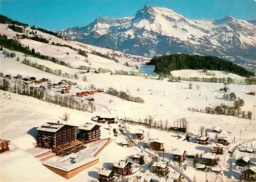 AK / Ansichtskarte Megeve Panorama sur les Aiguilles de Warens en hiver Station Sports d hiver vue aerienne Megeve