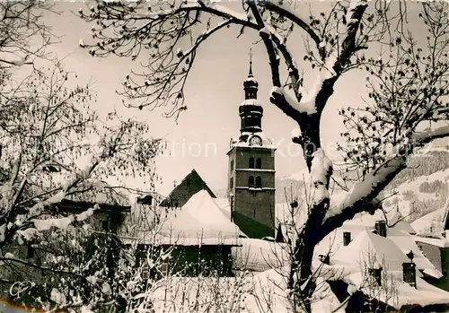 AK / Ansichtskarte Megeve Le clocher du village en hiver Megeve