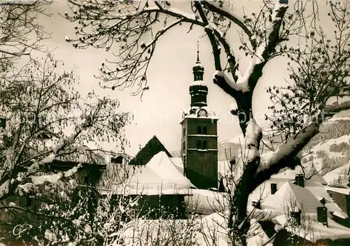 AK / Ansichtskarte Megeve Le clocher du village en hiver Megeve