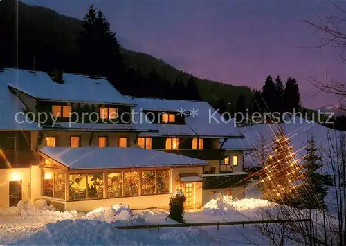 AK / Ansichtskarte Unterjoch Pension Joerg im Winter Nachtaufnahme Unterjoch