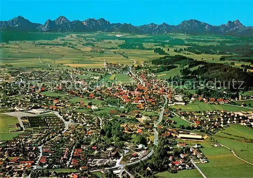 AK / Ansichtskarte Peiting mit Allgaeuer und Tiroler Hochgebirge Fliegeraufnahme Peiting