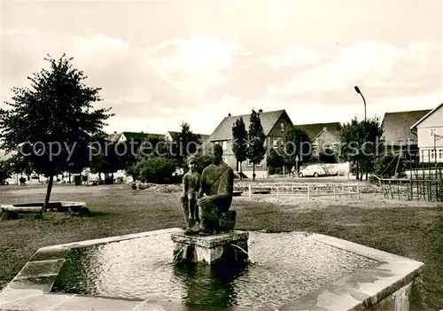 AK / Ansichtskarte Rasdorf_Huenfeld Brunnen Ortspartie Rasdorf Huenfeld