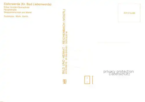 AK / Ansichtskarte Elsterwerda Etkar Andre Oberschule Hauptstrasse Wappenbrunnen am Markt Elsterwerda